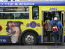 People boarding downtown bus.