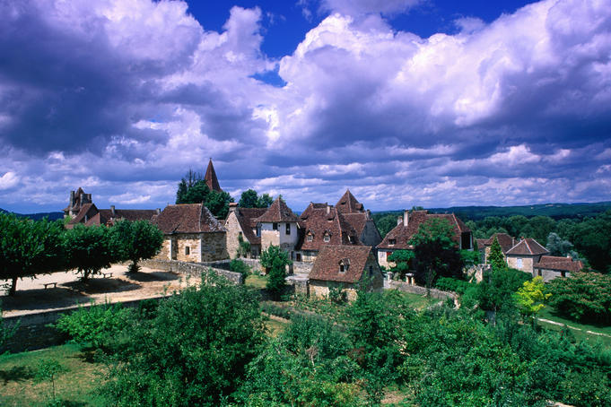 Village amidst the verdant surroundings, Dordogne valley, Lot region.