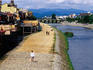 People on banks of Kamogawa river.