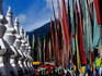 Tibetan stupas and flags at the entrance of Shuzheng village.