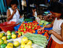Woman choosing vegetables at morning market in Belen.
