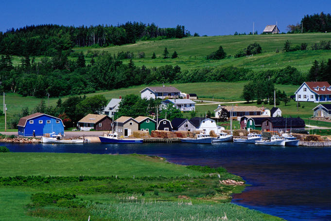 Lobster boats and traditional houses at French River, near Cavendish.