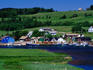Lobster boats and traditional houses at French River, near Cavendish.
