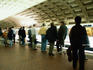 Commuters on platform at Metro station.