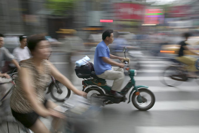 Two wheel traffic at the intersection of Central Sichuan and Nanjing Lu.