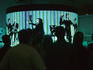 Students visiting the factory floor of company that designs and manufactures large installation plasma screen displays.