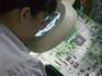 Manual inspection of a board at a manufacturer of special use PC's.