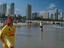 Lifesavers standing on a beach with people in the background.