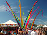 Stalls and crowds at the Byron Bay market.