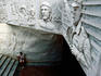Bas-relief of Castro, Guevara and other revolutionaries over subway entrance.
