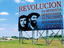Billboard showing Che Guevara, Camilo Cienfuegos and revolutionary slogans.