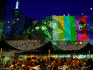 Crowd at Time Out Cafe at Federation Square at night.