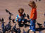 Children feeding pigeons at Plaza de Mayo.