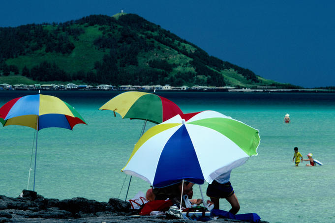 Beach umbrellas, sea and hill in background, Hyopchae Beach.