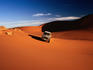 Four-wheel drive on Awinet sand dunes, Fezzan.