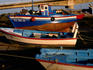 Colourful fishing boats, Rio Sequa at low tide.