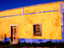 Exterior wall of colourful old house.