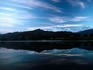 Annapurna Himal reflected in Phewa Lake at sunrise.