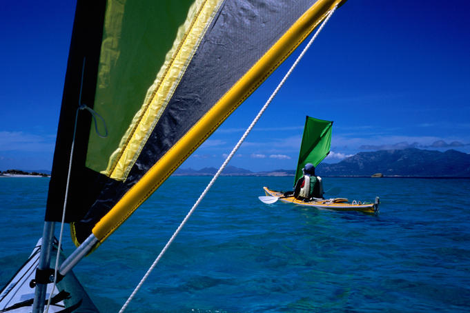 Sea kayakers under sail, Furneaux Islands, Bass Strait.