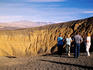 Visitors looking over Ubehebe Crater.