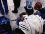Jewish soldier praying at Wailing Wall.
