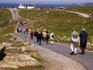 People strolling a coastal path.