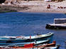Palaio Faliro, boats in foreground with beach and city in distance, Mediterranean.