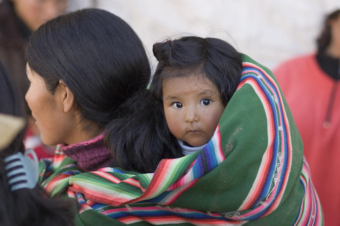 Mother with her wide eyed child, Puno
