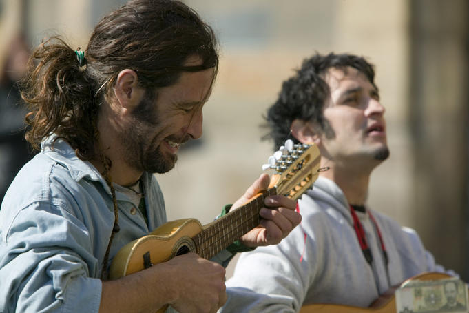 Street musicians playing for tips.