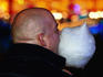 Stuttgarter Volksfest, man eating cotton candy, fairy floss.