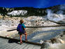 Visitor on boardwalk looking at fumaroles, Bumpass Hell.