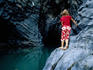 Girl looking into rock pool, Alcantara Gorge.