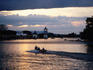 Boat on Sarawak River with Istana in background.