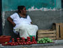 Woman from village of Kanasin displaying her vegetables on market day.
