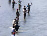 Fishermen line Ship Creek during salmon run.