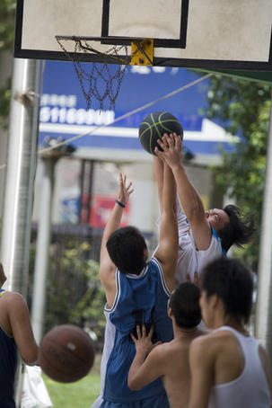 Playing basket ball beside Shanghai Stadium, Hongqiao.