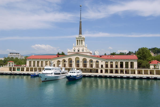 Sea Terminal building with presidential yacht (larger one) moored in front.