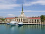 Sea Terminal building with presidential yacht (larger one) moored in front.