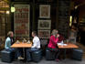 Women having coffee outside cafe in Center Place, city centre.