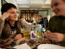 Students drinking beer in local bar.
