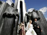 Young couple visiting Afghan war memorial on Island of Tears on their wedding day.