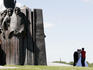 Young couple having their wedding photos taken on Island of Tears (Afghan war memorial).