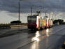 Tram running across Akmens Bridge after thunder storm.