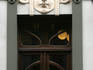 Woman walking past door of Art Nouveau building in old town Riga.
