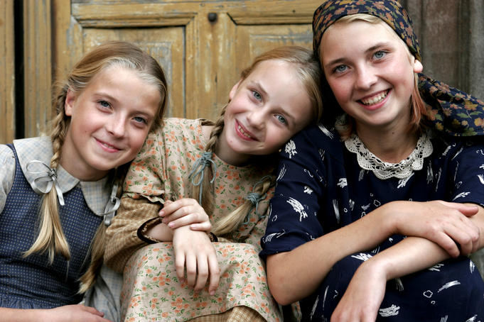Portrait of three young local girls in their traditional dress.