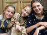 Portrait of three young local girls in their traditional dress.