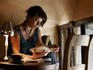 University student reading in cafe.