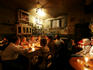 People in 'kitchen room' of famous Alchemia Bar, old Jewish quarter.