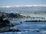 City with southern Alps in background seen from Sumner, Estuary.
