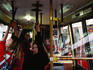 Passengers inside cable car.